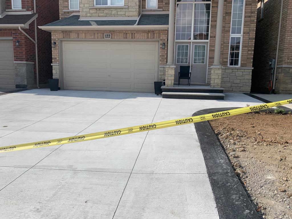 Regular broom finish with stamped border concrete driveway Hamilton